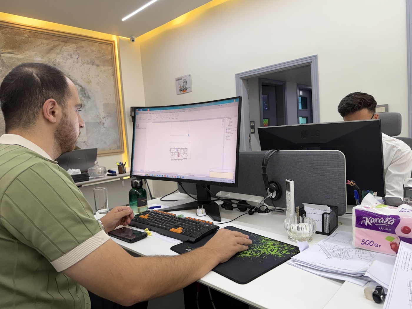 Engineer reviewing a BIM floor plan at LINE Engineering Consultants